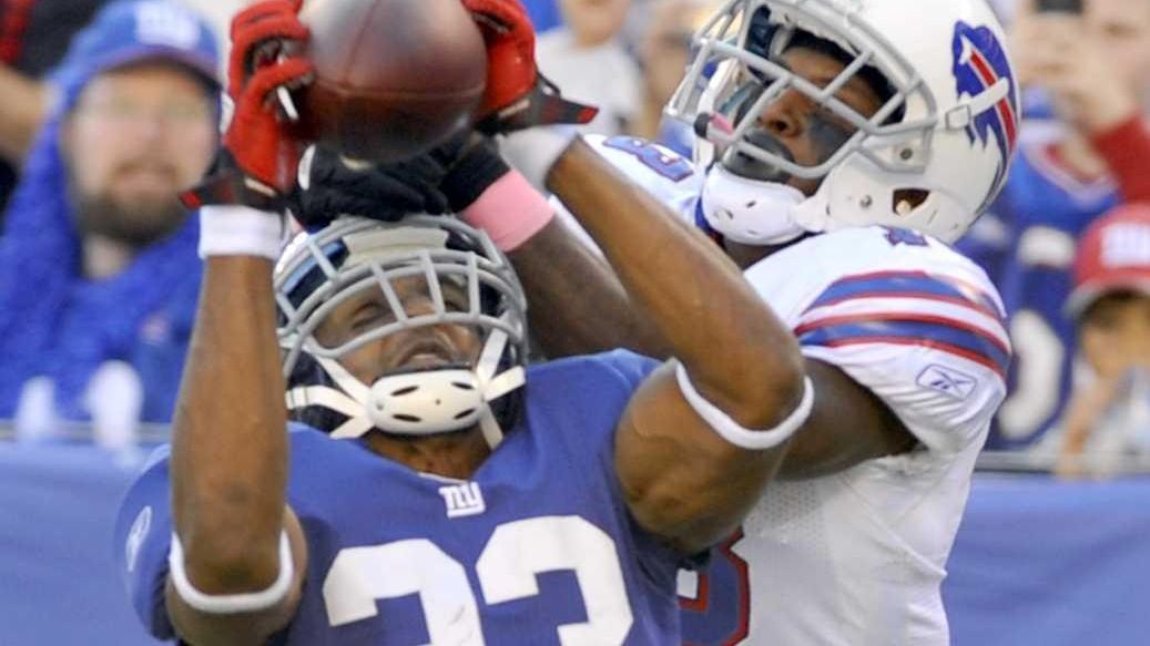 New York Giants Corey Webster watches Buffalo Bills Stevie Johnson score a  9 yard touchdown in the fourth quarter in week 6 of the NFL season at  MetLife Stadium in East Rutherford