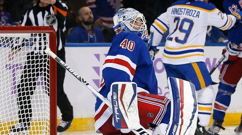 Rangers goaltender Alexandar Georgiev reacts after a goal by Sabres left...