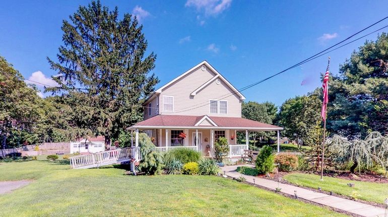 A team of workers stripped this 2,200-square-foot Medford home to...