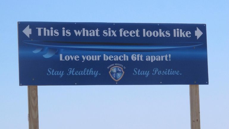 A sign on the Seaside Heights, N.J., boardwalk on May...