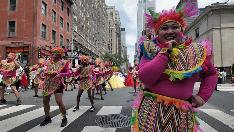 People participate in the Philippine Independence Day parade in New...