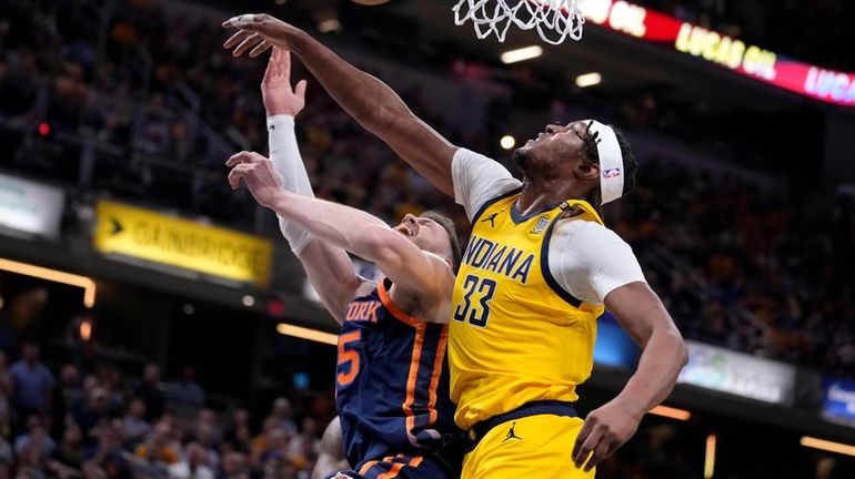 Pacers center Myles Turner blocks a shot by Knicks center Isaiah Hartenstein during...