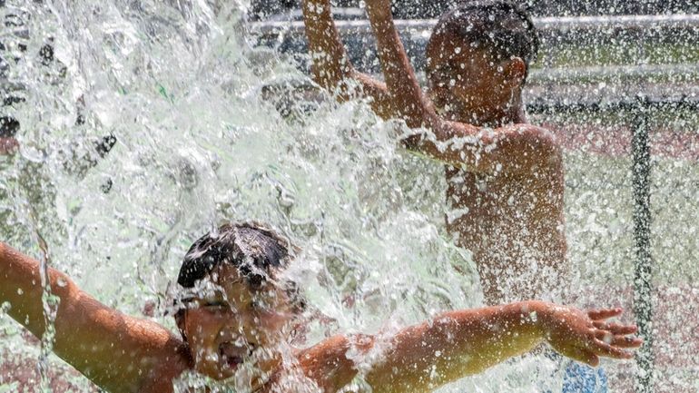 Blazing hot sun Wednesday made the water park at Manor Field...