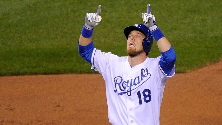 Ben Zobrist celebrates after hitting a solo home run in...