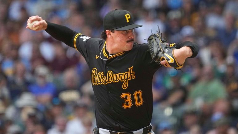 Pittsburgh Pirates pitcher Paul Skenes throws during the fourth inning...