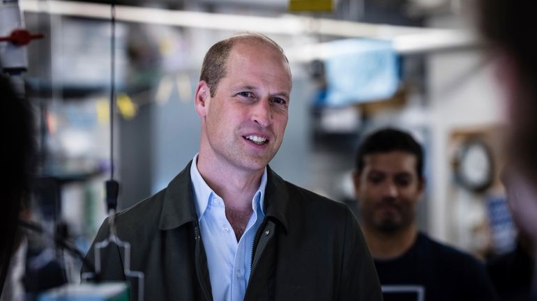 Britain's Prince William, Prince of Wales speaks to students from...