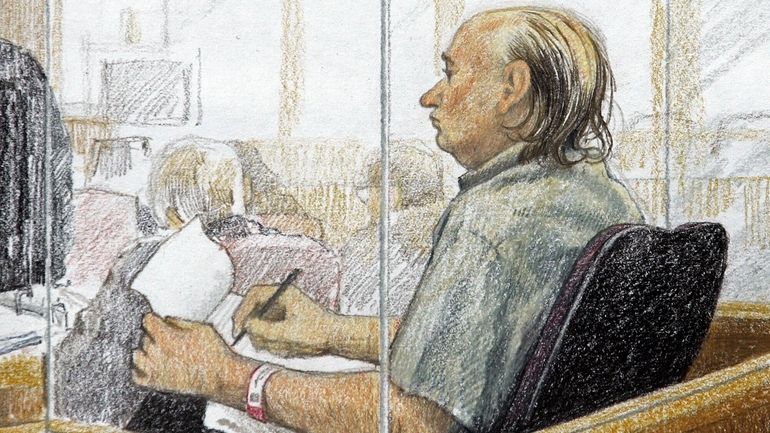 This artist's sketch shows accused serial killer Robert Pickton taking...