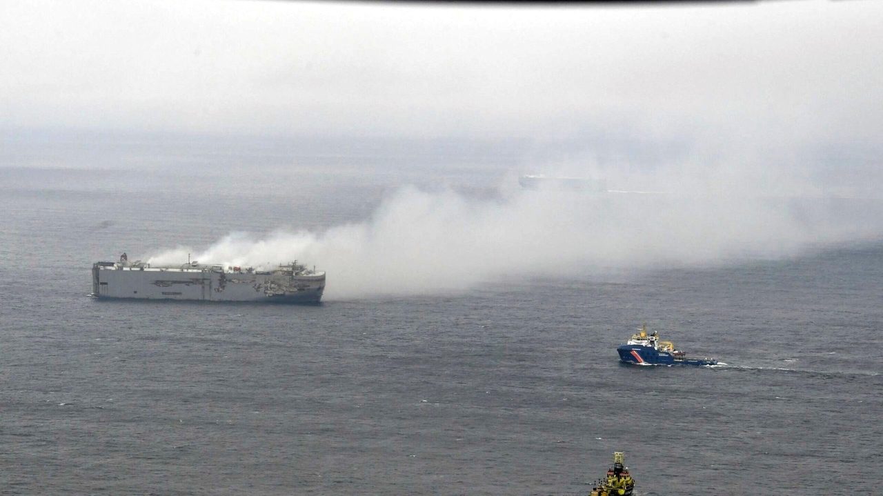 Salvage crews board a cargo ship burning off the Netherlands. The smoke ...