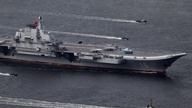 FILE -The Liaoning, China's first aircraft carrier, sails into Hong...