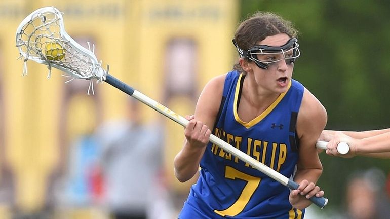 Ava Obloj of West Islip gets pressured by Mabel Overbeck of Garden...