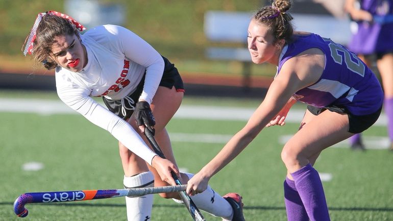 Pierson's Meredith Spolarich (11) takes a shot while covered by...