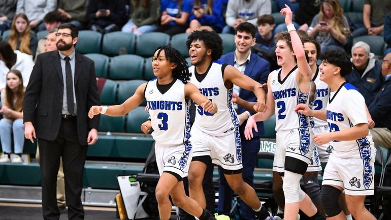 From left, Smithtown Christian coach Daniel Skaritka and players Nehemiah...