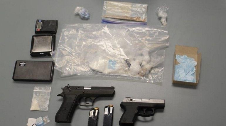 Nassau County police officials say they seized guns and drugs...