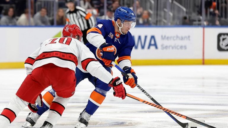 Bo Horvat #14 of the New York Islanders skates against...