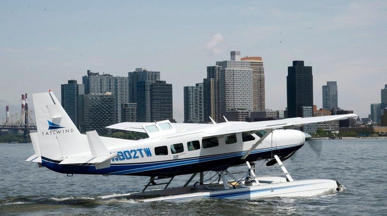 A Tailwind seaplane taxis in the East River in Manhattan...