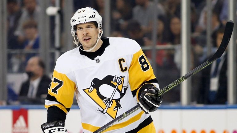 Sidney Crosby #87 of the Pittsburgh Penguins looks on in...