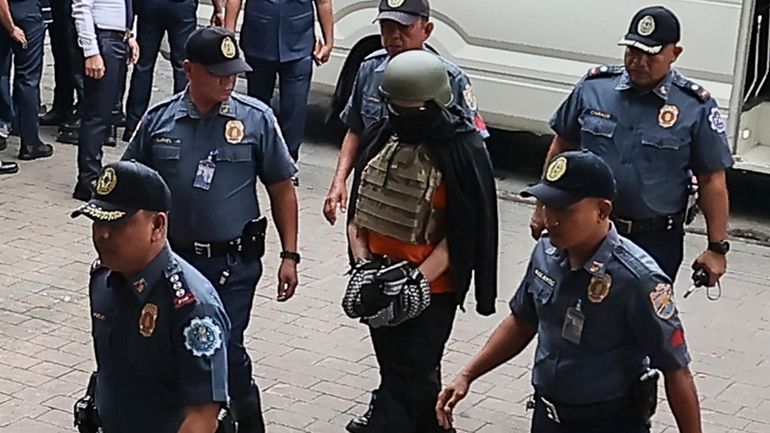 Apollo Carreon Quiboloy, wearing a helmet and flak jacket, a...