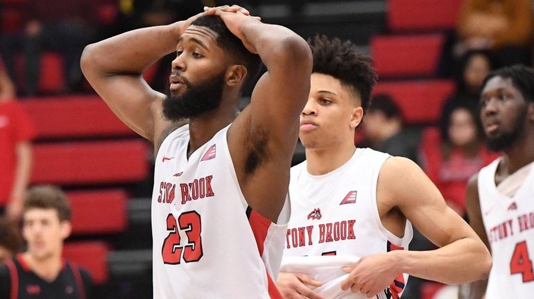 Stony Brook guard Andrew Garcia and teammates react after their...