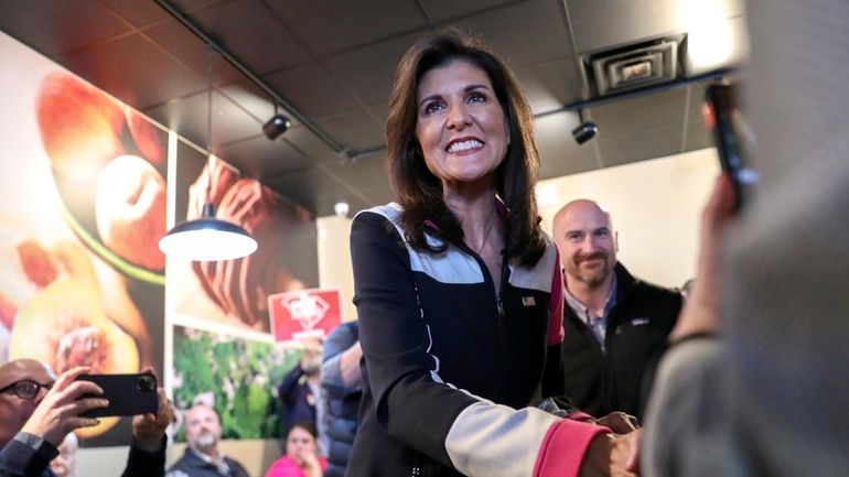 Republican presidential candidate former UN Ambassador Nikki Haley shakes hands...