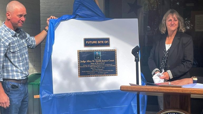 A temporary plaque dedicating Riverhead Town's new Justice Court to...