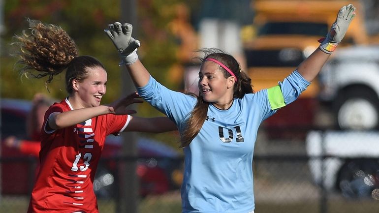 Lexie Thompson, MacArthur goalie, right, and Caitlin Barry #13 celebrate...