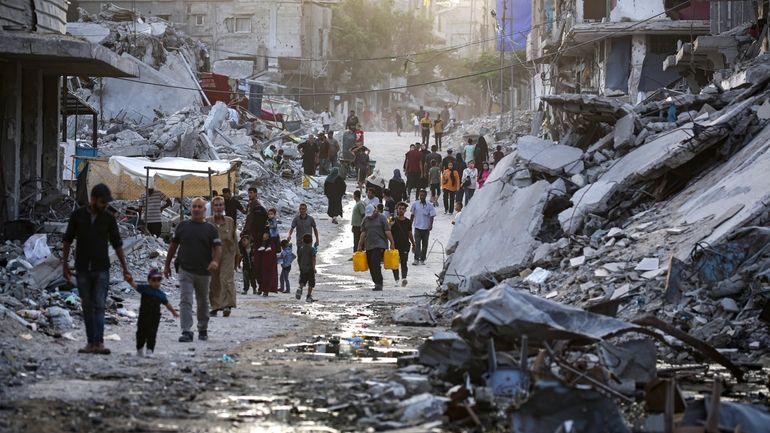 Palestinians displaced by the Israeli air and ground offensive on...