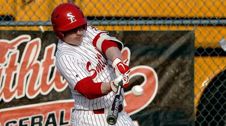 Smithtown East's Ryan Pennisi (8) strokes a solo homer to...