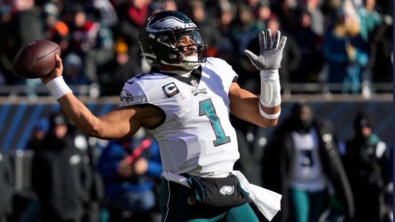 Philadelphia Eagles' Jalen Hurts passes during the first half of...