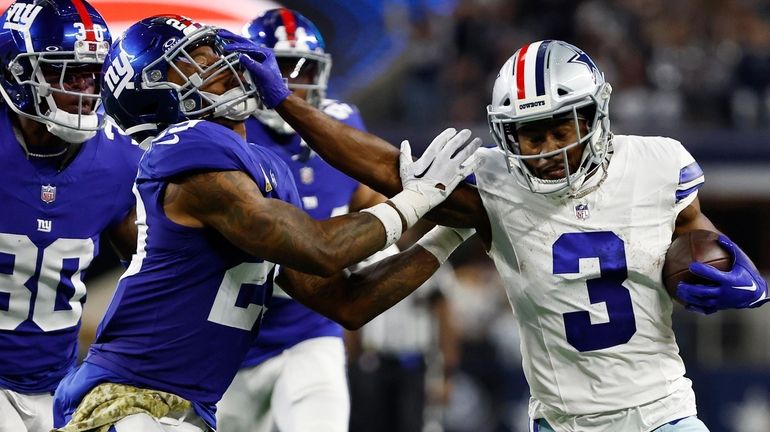 Dallas Cowboys wide receiver Brandin Cooks (3) fights off a...