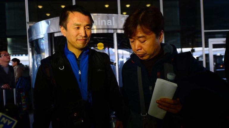 Jin-won Ahn, left, and Eui-ho Kim, family of Metro-North train...