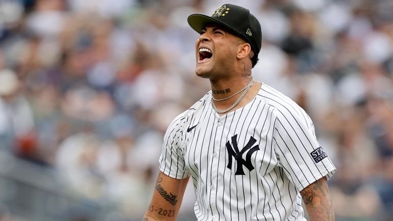 Luis Gil #81 of the New York Yankees reacts after...