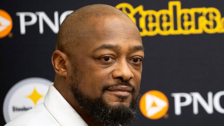 Pittsburgh Steelers head coach Mike Tomlin listens during a press...