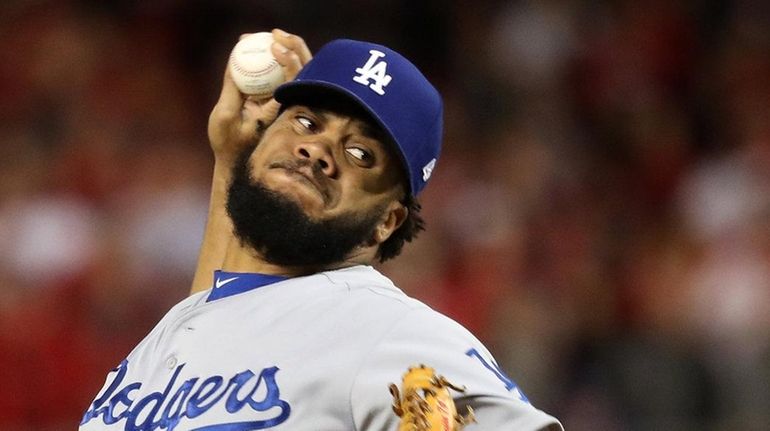 Kenley Jansen #74 of the Los Angeles Dodgers works against...