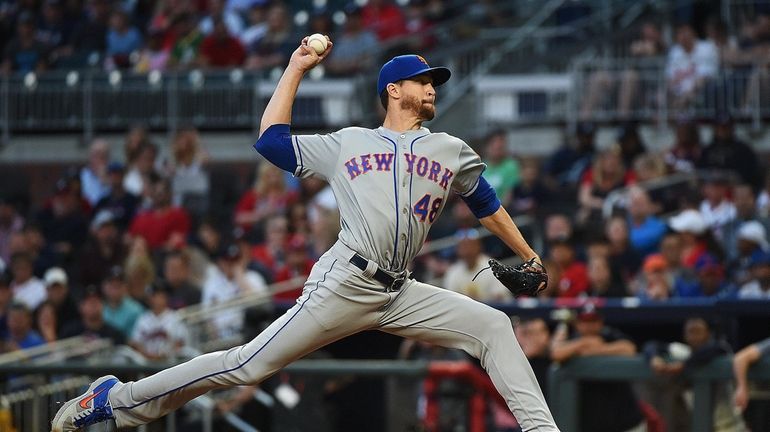 Jacob deGrom #48 of the New York Mets pitches in...