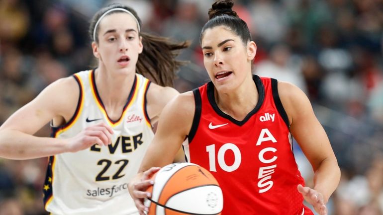 Las Vegas Aces guard Kelsey Plum (10) takes the ball...