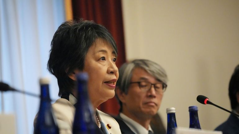 Japanese Foreign Minister Yoko Kamikawa, left, speaks during a meeting...