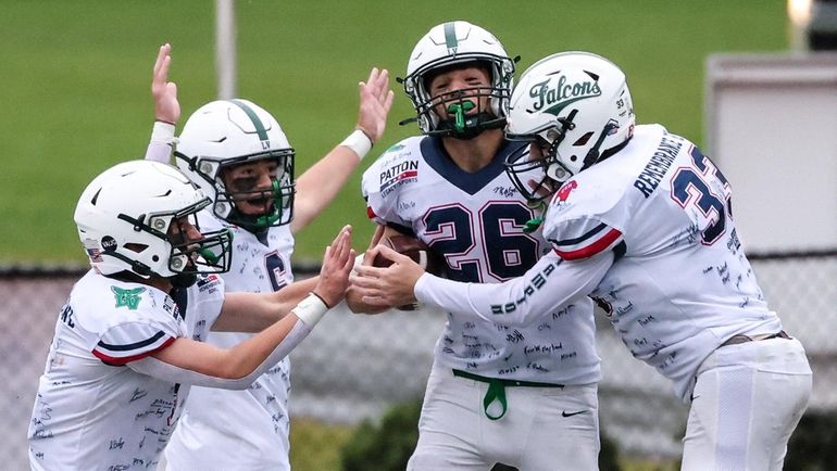 Locust Valley's Michael DiLorenzo celebrates his touchdown from a fumble...