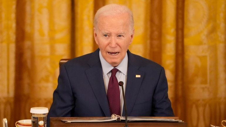 President Joe Biden speaks during a trilateral meeting with Philippine...