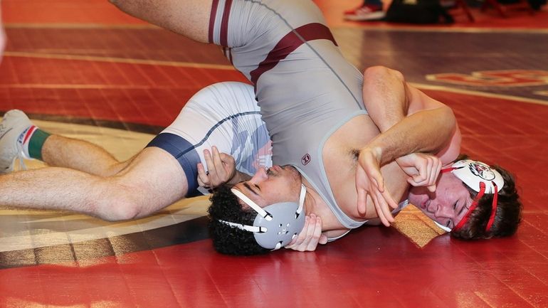 Cold Spring Harbor’s Greyson Meak defeats Clarke's Marcus Rosario in...