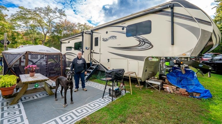 Larry Goldman and his dog, Duke, are full-time seasonal residents...