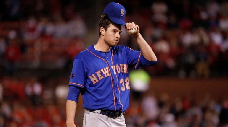 Mets starting pitcher Steven Matz waits on the mound before...