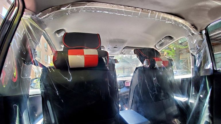 A view of a plastic lining separating the Uber driver...