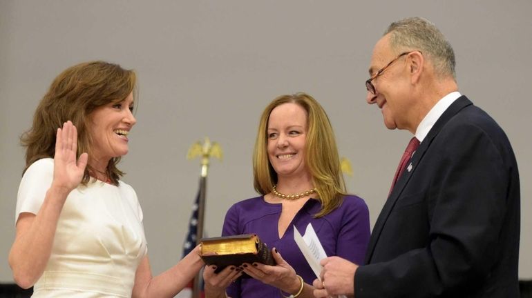 Rep. Kathleen Rice takes the oath of office administered by...