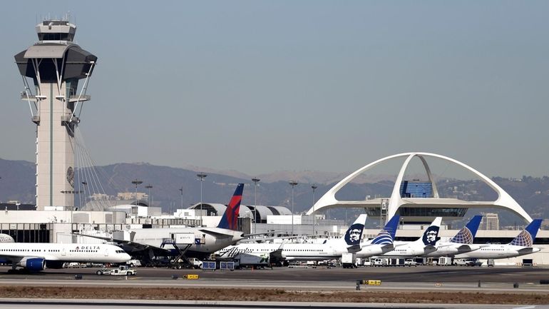 Planes sit on the tarmac at Los Angeles International Airport,...