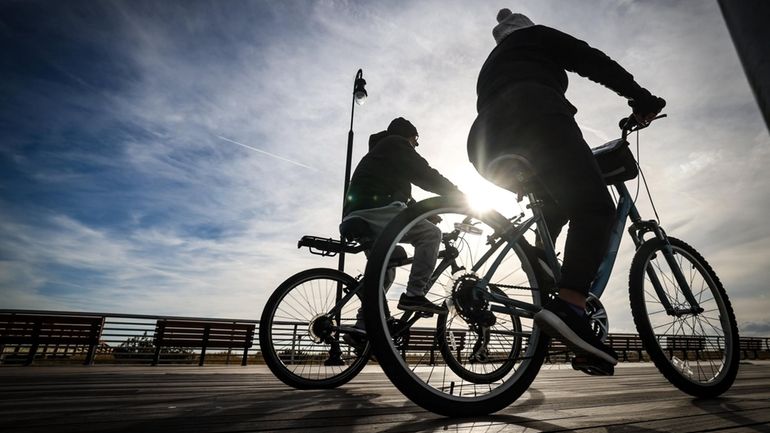 Two men sharing a conversation while out for exercise on...