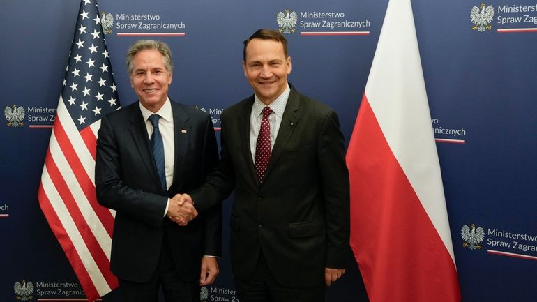 U.S. Secretary of State Antony Blinken, left, welcomes by Polish...