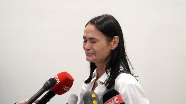 British actor Charlotte Lewis reacts after the verdict against filmmaker...