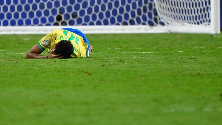 Brazil's Rodrygo grimaces in pain during a Copa America quarterfinal...