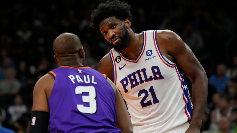 Phoenix Suns guard Chris Paul (3) and Philadelphia 76ers center...