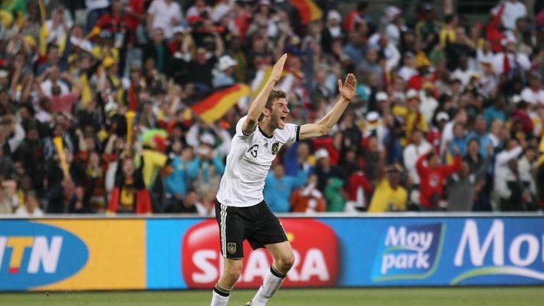 Thomas Mueller of Germany celebrates scoring his team's fourth goal...